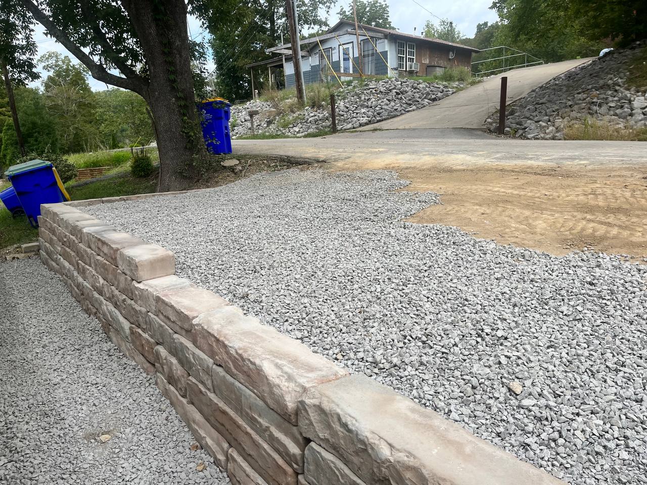 goperfection-RetainingWalls-Greenville Natural stone retaining wall to help level out a client surface.