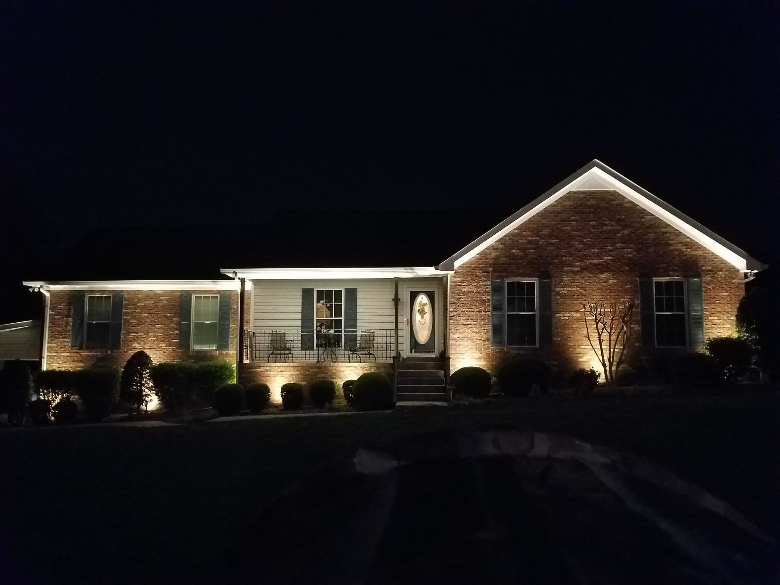 Another beautiful home lit up at night from amazing landscape lighting installed by our crew.